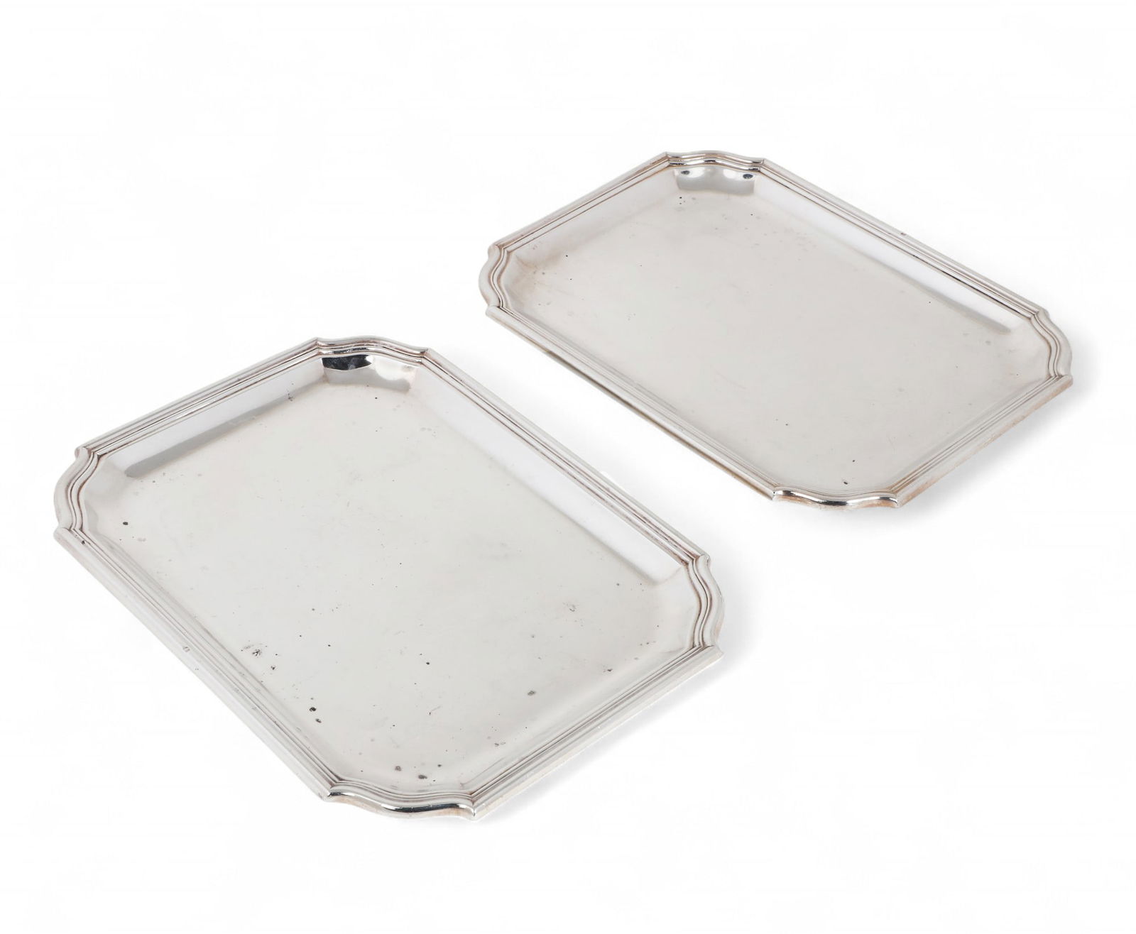 A pair of small Puiforcat silver rounded rectangular trays, 20th century: A pair of small Puiforcat silver rounded rectangular trays20th centurylength 10in (25.5cm); width 7 1/4in (18cm); total weight approximately 30oz troy Provenance:Property from a Private Bel Air Estat