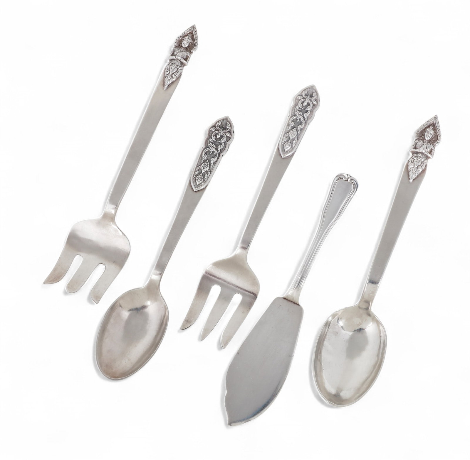 A five piece group of Thai and French silver serving flatware, 20th century: A five piece group of Thai and French silver serving flatware 20th century Comprising two pairs of Thai salad servers and a French fish slice. lengths ranging from 9 3/4 to 11 1/2in (24.5 to 29cm); to