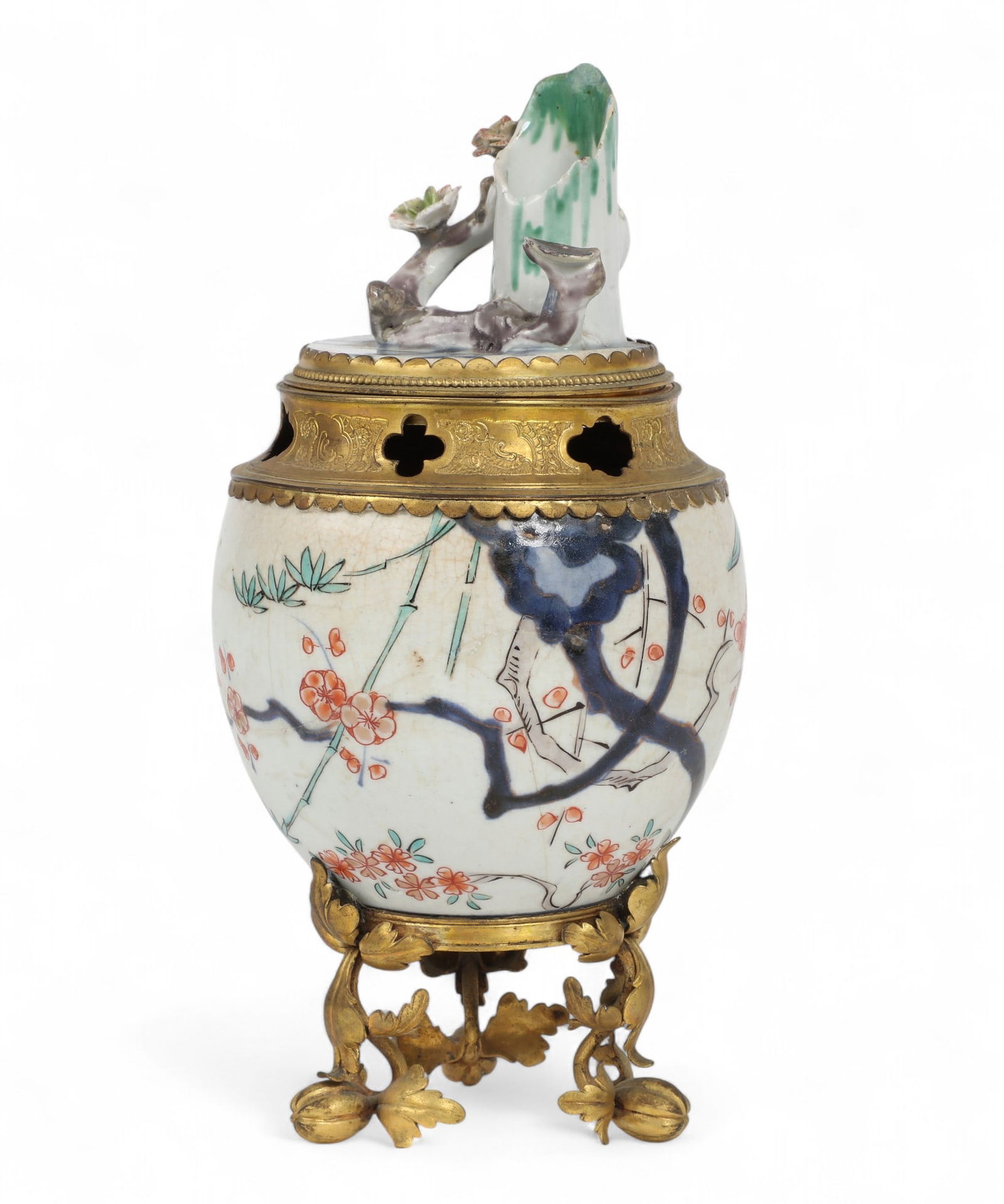 A French gilt bronze mounted porcelain pot pourri, 19th century: A French gilt bronze mounted porcelain pot pourri19th centuryheight 9in (22.5cm); width 4 3/4in (12cm) Provenance:Property from a Private Bel Air Estate.