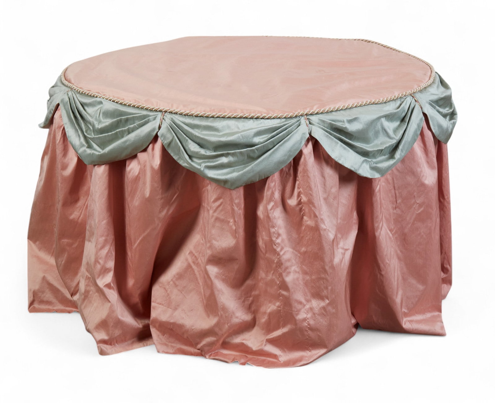 A contemporary rose and blue swagged satin covered center table: A contemporary rose and blue swagged satin covered center table height 27in (67.5cm); diameter 42in (105cm) Provenance: Property from a Private Bel Air Estate.