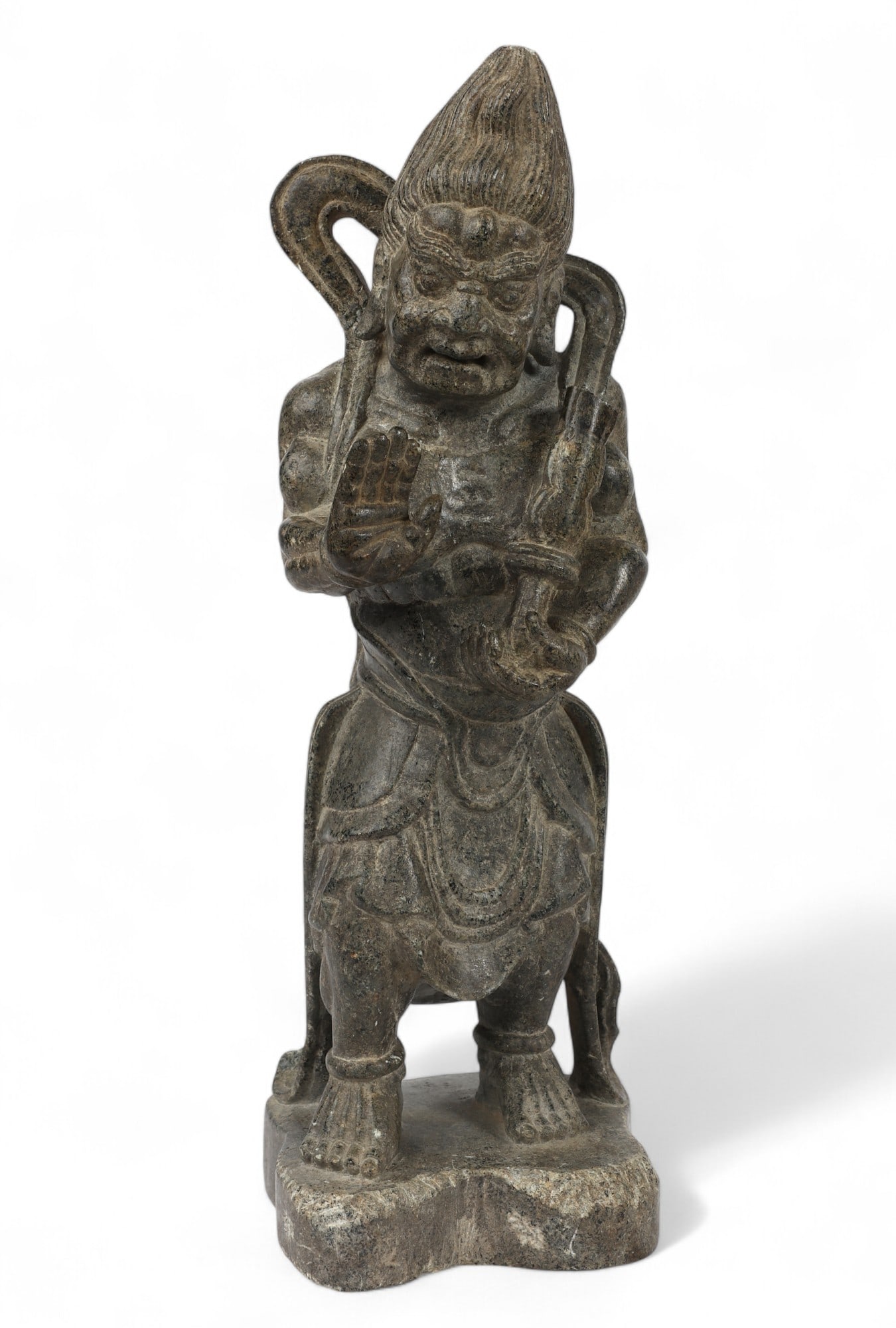 A Japanese carved stone figure of a possibly Shinto deity: A Japanese carved stone figure of a possibly Shinto deity height 12 1/4in (31cm); width 5in (13cm); depth 4 3/4in (12cm) Provenance: Property from the Estate of Victor H. Shear.