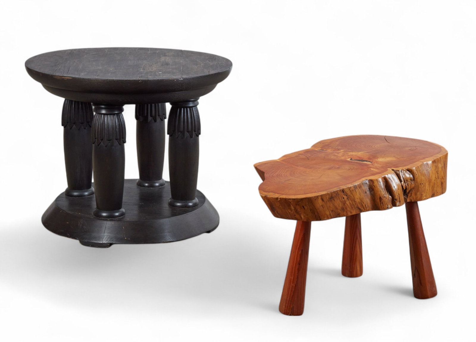 A Continental Neoclassical style ebonized carved oak center table: A Continental Neoclassical style ebonized carved oak center table and a live edge hardwood low table modern (2) larger height 28 1/4in (71.5cm); diameter 35 1/2in (90cm) Provenance: The ebonized ta