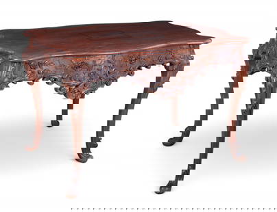 A Portuguese Rococo style walnut center table, 19th century: A Portuguese Rococo style walnut center table19th centuryheight 32in (81cm); width 51in (130cm); depth 34in (86.5cm) Provenance:From a Private Collection Hancock Park, California