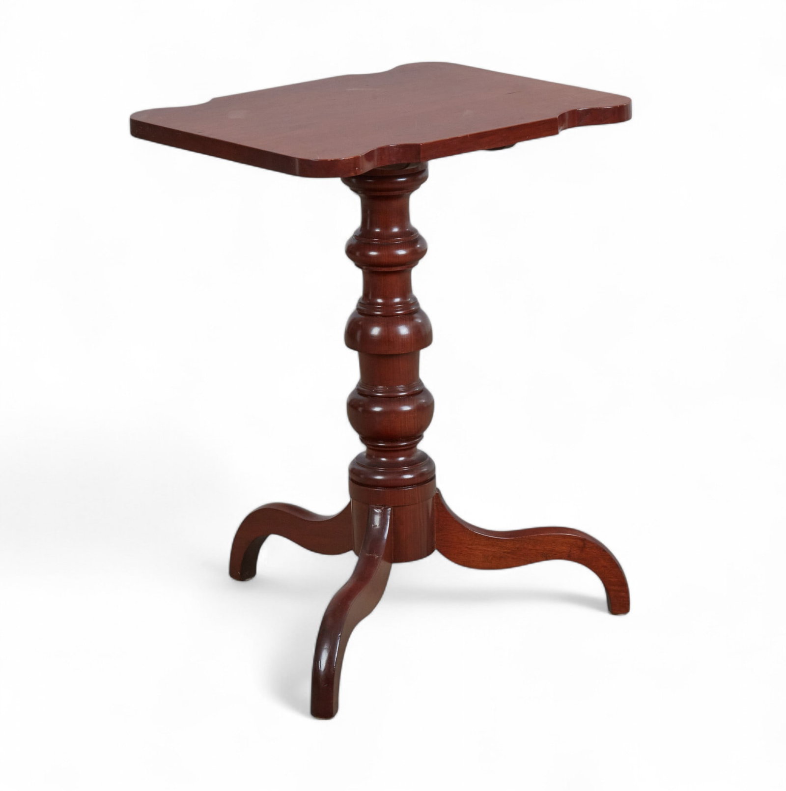 A Federal mahogany tilt top candlestand, 19th century: A Federal mahogany tilt top candlestand 19th century height 27 1/2in (70cm); width 20in (51cm); depth 16 1/4in (41cm) Provenance: Property from the collection of Gladyne K. Mitchell, San Francisco, Ca