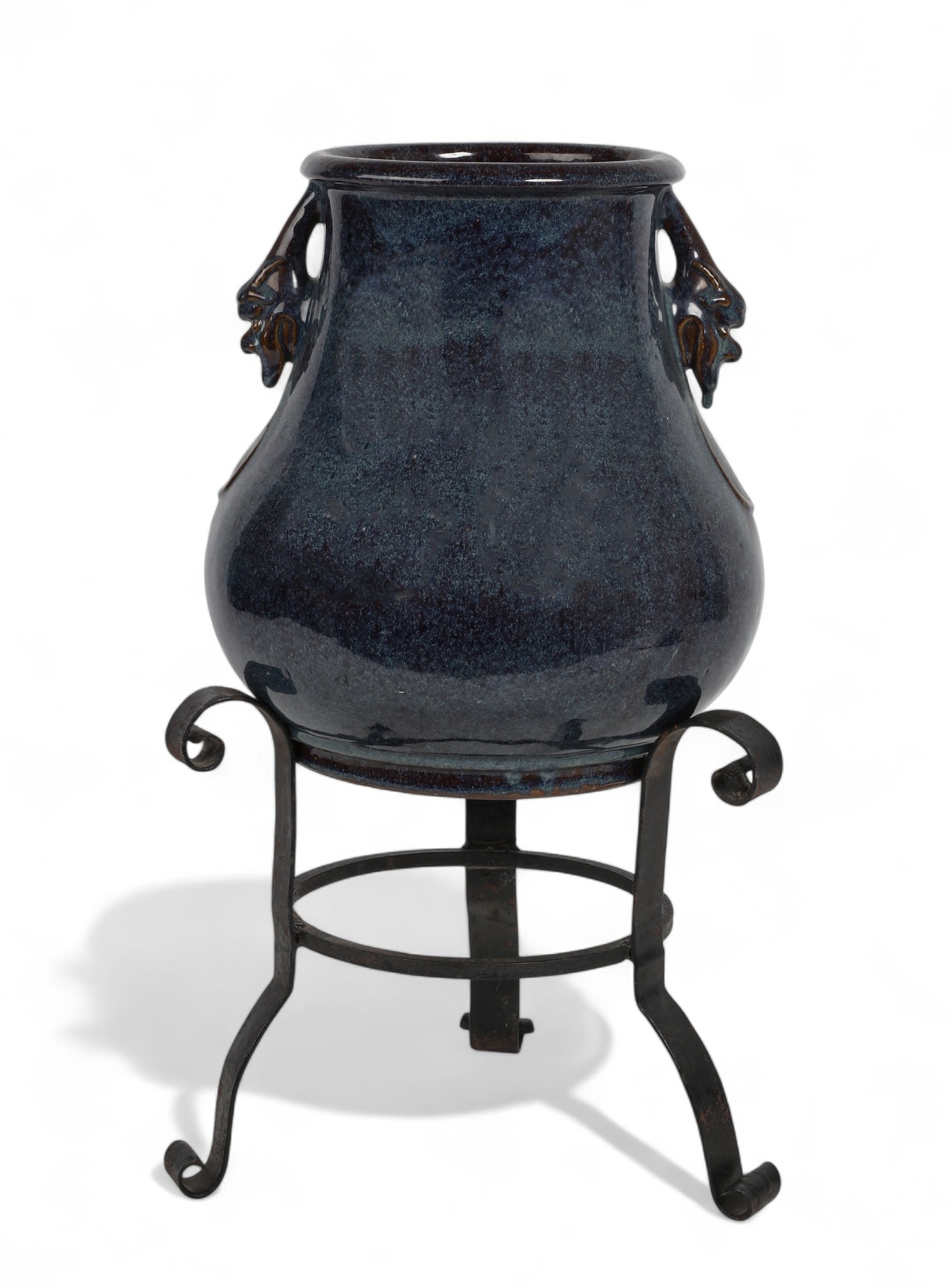 A large East Asian transmutation glazed vessel with fanciful beast handles: A large East Asian transmutation glazed vessel with fanciful beast handles With impressed seal mark to underside reading Gaode Jianzao/Takanori kanzo, on associated iron stand. vase height 13 1/2in (3