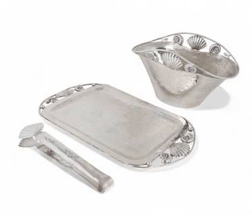 A three piece suite of Emilia Castillo silverplate Sea Life tableware, second half 20th century: A three piece suite of Emilia Castillo silverplate Sea Life tablewaresecond half 20th centuryComprising an ice bucket, a pair of tongs and an oval tray.ice bucket height 9 1/4in (23.5cm); width 16 1/2