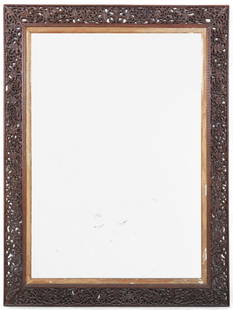 A large Anglo Indian parcel gilt reticulated hardwood mirror, 20th century: A large Anglo Indian parcel gilt reticulated hardwood mirror20th centuryheight 80 1/2in (204.5cm); width 60 1/2in (153.5cm) Provenance:From a Private Collection Hancock Park, California