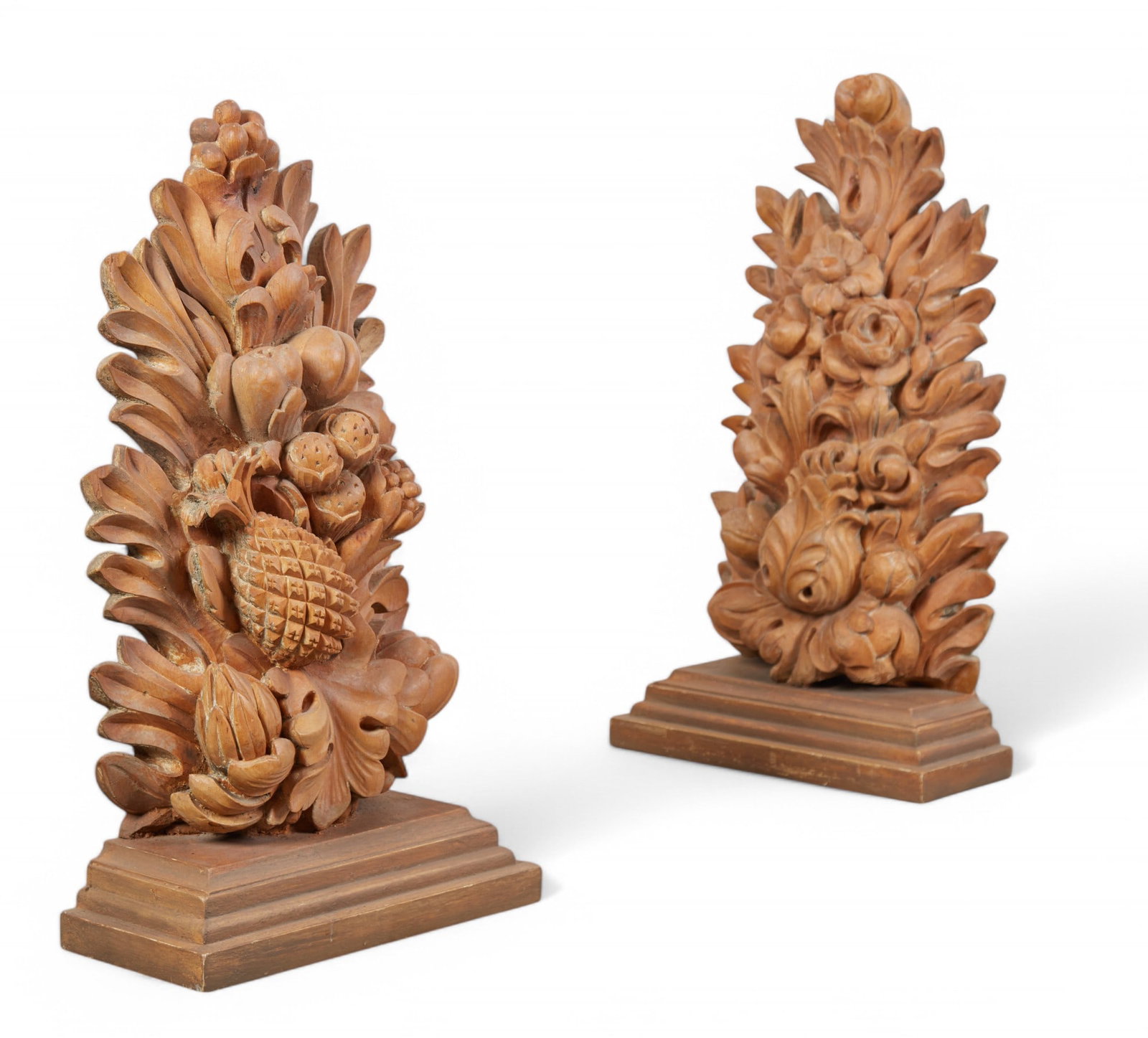 A pair of Continental carved pine floral and fruit brackets, 19th century: A pair of Continental carved pine floral and fruit brackets19th centuryheight 32in (81cm); width 17 1/2in (44cm); depth 8in (20cm) Provenance:From a Private Collection Hancock Park, California