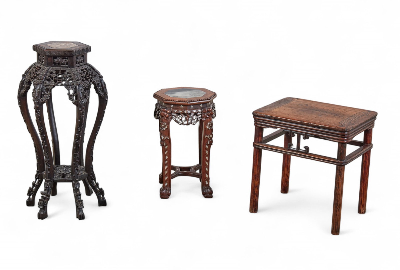 A Chinese hardwood table and two marble inset stands: A Chinese hardwood table and two marble inset stands(3)taller stand height 32 1/2in (82.5cm); diameter 16in (41cm)