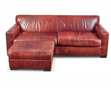 A brown leather sofa and ottoman, modern: A brown leather sofa and ottomanmodern(2)sofa height 29 1/2in (75cm); width 82in (209cm); depth of seat 27in (69cm)