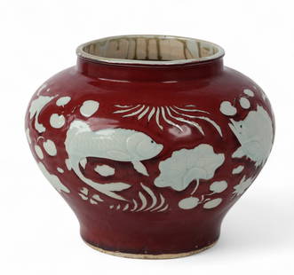 A Chinese urn with fish motif design in a fitted box: A Chinese urn with fish motif design in a fitted boxheight 11 x diameter 13 in. (27.9 x 33 cm.)