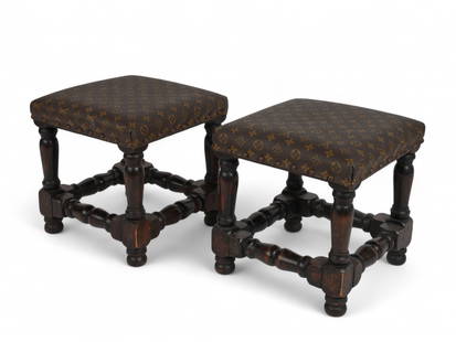 A pair of William & Mary style stools with Louis Vuitton canvas upholstery: A pair of William & Mary style stools with Louis Vuitton canvas upholsteryEach stool with nailed trim and a square upholstered seat. Raised on turned legs joined by box stretchers, Seat suspension con