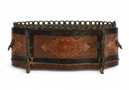 A French Napoleon III style gilt bronze-mounted marquetry jardinière: A French Napoleon III style gilt bronze-mounted marquetry jardinièrelate 19th/early 20th centurySerpentine form with floral marquetry panels, pierced gilt bronze gallery, handles, and feet; fitted wi