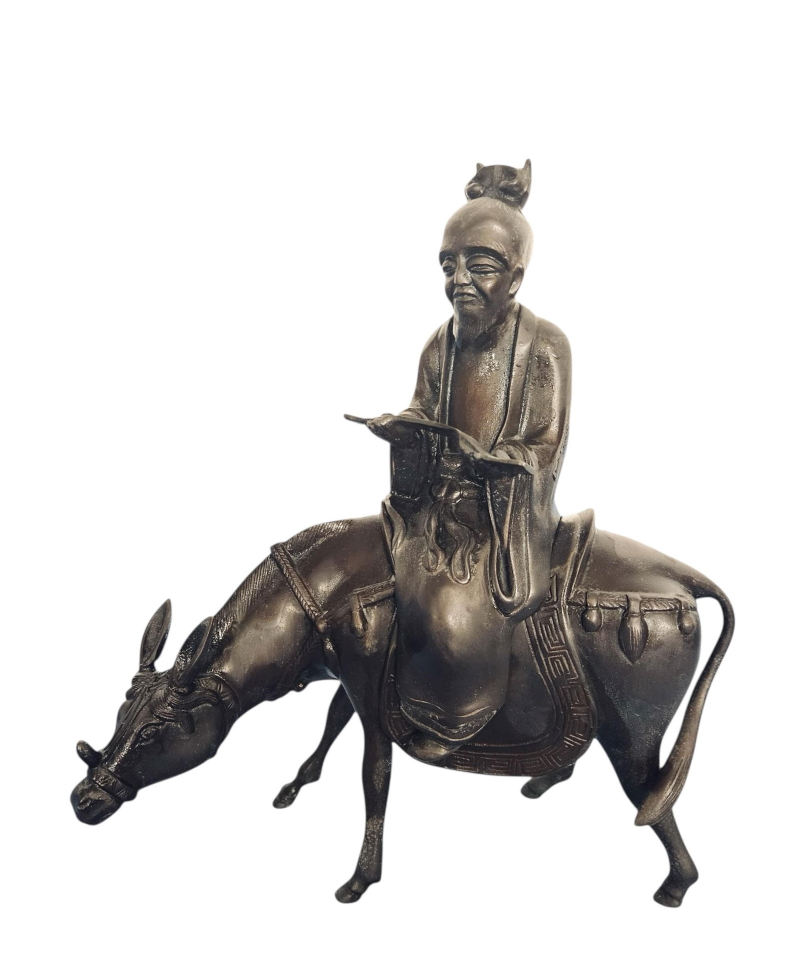 A Chinese bronze figure of a scholar riding a donkey: A Chinese bronze figure of a scholar riding a donkeyCast in two sections, the robed figure seated atop a saddled donkey with incised decoration to the garments, harness, and saddle. Possibly intended