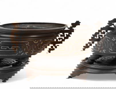 A Chinese bronze censer on stand: A Chinese bronze censer on standCast in relief with archaic motifs and key-fret borders, the sides with twin geometric