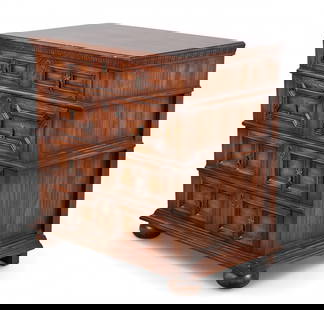 A Charles II-style oak chest of drawers by Banks & Goldstone for Sarreid Ltd: A Charles II-style oak chest of drawers by Banks & Goldstone for Sarreid LtdWith four drawers featuring molded geometric fronts, brass escutcheons, and dentil-molded cornice, raised on bun feetheight