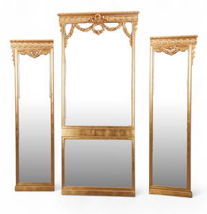 A set of three Louis XVI style giltwood pier mirrors: A set of three Louis XVI style giltwood pier mirrorsComprising a central tall rectangular mirror surmounted by carved floral swags, flanked by two narrower companion mirrors with beaded and egg-and-da