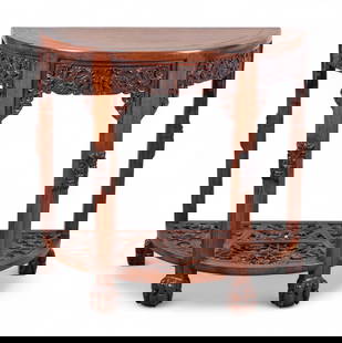 A Chinese carved demilune table: A Chinese carved demilune tableHardwood table with pierced apron and lower shelf carved with dragons and clouds. Single drawer and claw feet.height 33 in. (83.8 cm); width 34 in. (86.4 cm); depth 17?