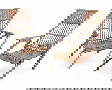 A pair of wicker lounge chairs by Outdoor Interiors: A pair of wicker lounge chairs by Outdoor Interiors