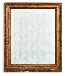 A carved and giltwood wall mirror: A carved and giltwood wall mirrorThe rectangular frame with deep cavetto molding and egg-and-dart inner border, the outer edge carved with scrolling leaf and beadwork details.height 32 1/2in (82.5cm);