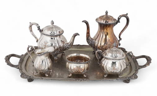 A Wilcox five-piece silver-plated tea and coffee service together with a two-handled tray: A Wilcox five-piece silver-plated tea and coffee service together with a two-handled trayComprising coffee pot, tea pot, cream jug, sugar bowl and oval tray, each piece with engraved foliate decoratio