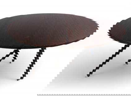 A contemporary oval dining table: A contemporary oval dining tableWith dark stained veneered top and black-painted metal legs on casters.height 30in (76cm); width 67 1/4in (171cm); depth 52in (132cm)