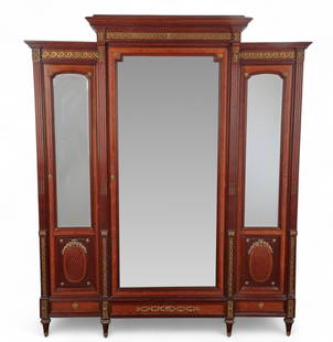 A Louis XVI style gilt bronze mounted mahogany walnut and parquetry armoire, early 20th century: A Louis XVI style gilt bronze mounted mahogany walnut and parquetry armoireearly 20th centuryLock stamped B&P PARIS in an oval.height 98in (249cm); width 82in (208cm); depth 23 1/2in (60cm) Proven