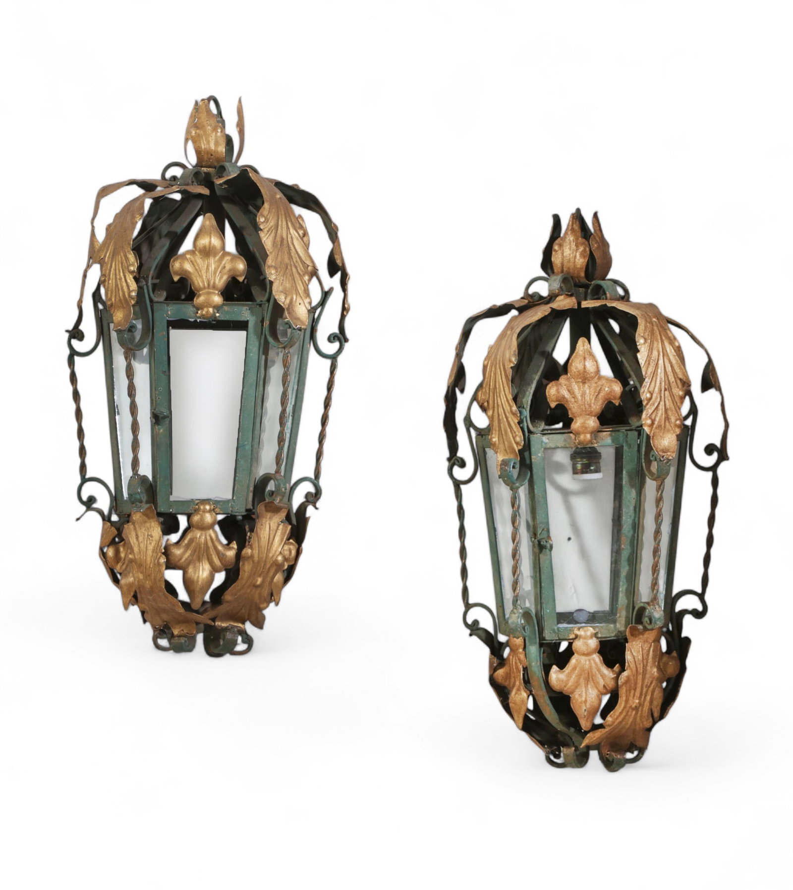 A pair of Baroque style gilt metal, iron and glass lanterns, post 1950: A pair of Baroque style gilt metal, iron and glass lanternspost 1950 height 43in (119cm); width 11 1/2in (29cm); depth 17 1/2in (44cm) (29cm)