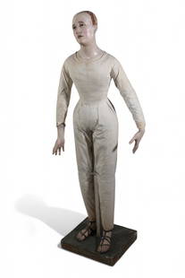 A life size Italian painted composition and muslin standing creche figure, 18th/19th century: A life size Italian painted composition and muslin standing creche figure18th/19th centuryWith inset glass eyes, on painted wood stand.overall height 53in (132.5cm); width 19in (47.5cm); depth 11 3/4i