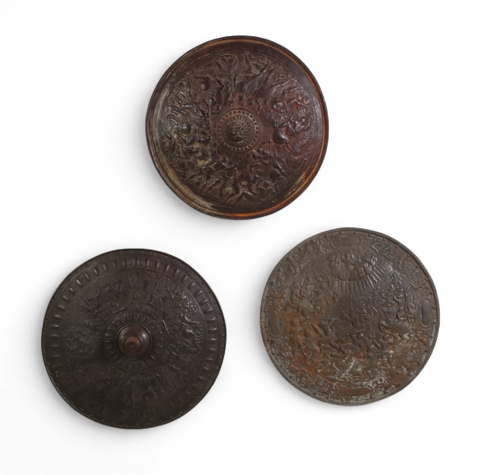 A group of three Renaissance style cast metal circular shields, 19th-20th century (1 of 9)