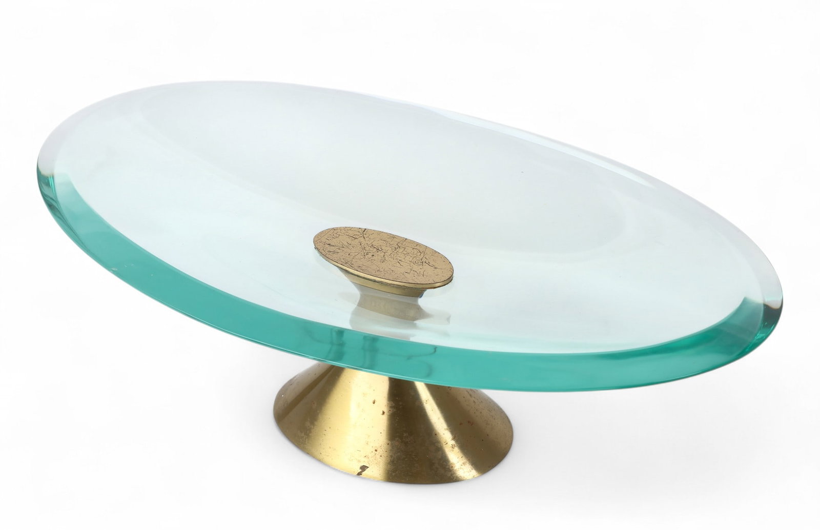 A Max Ingrand for Fontana Arte brass and glass oval centerpiece bowl, third quarter 20th century: A Max Ingrand for Fontana Arte brass and glass oval centerpiece bowlthird quarter 20th centuryMarked FONTANA / ITALY.height 5in (12.5cm); width 14 1/2in (37cm); depth 8in (20cm)