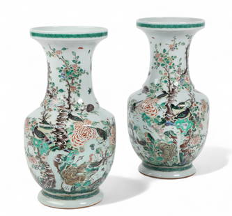 A pair of Chinese Famille Verte porcelain vases: A pair of Chinese Famille Verte porcelain vasesWith underglaze blue double circle marks to underside.height 16 1/4in (40.5cm); width 8 1/2in (21cm)