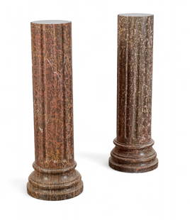 Two similar fluted variegated marble columns, modern: Two similar fluted variegated marble columnsmodernheight 46in (115cm); diameter 14 1/2in (36cm) Provenance:Property from the Private Collection of Larry Bond, Utah.