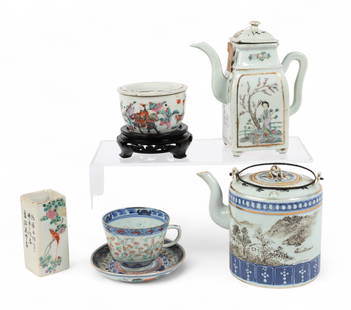 A five piece group of Chinese Famille Rose porcelain table wares: A five piece group of Chinese Famille Rose porcelain table waresComprising a brush holder, two teapots, a cricket box on stand and a teacup and saucer, variously marked to undersides.taller teapot hei