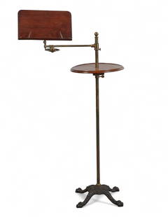 An English cast iron, brass and mahogany adjustable reading stand, circa 1900: An English cast iron, brass and mahogany adjustable reading standcirca 1900With telescopic tiers, adjustable reading stand and folding candle arm. Stamped with initials S M centered by a sunburst to b
