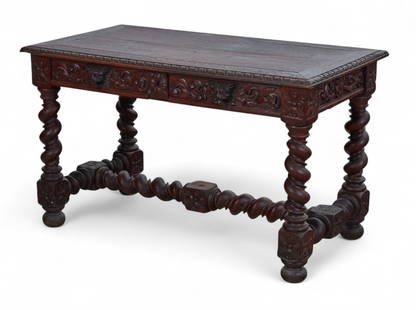 A Baroque style oak table, early 20th century: A Baroque style oak tableearly 20th centuryFitted with two frieze drawers to one side.height 30 1/4in (75.5cm); width 51in (127.5cm); depth 27 3/4in (69.5cm) Provenance:Property from the Privat