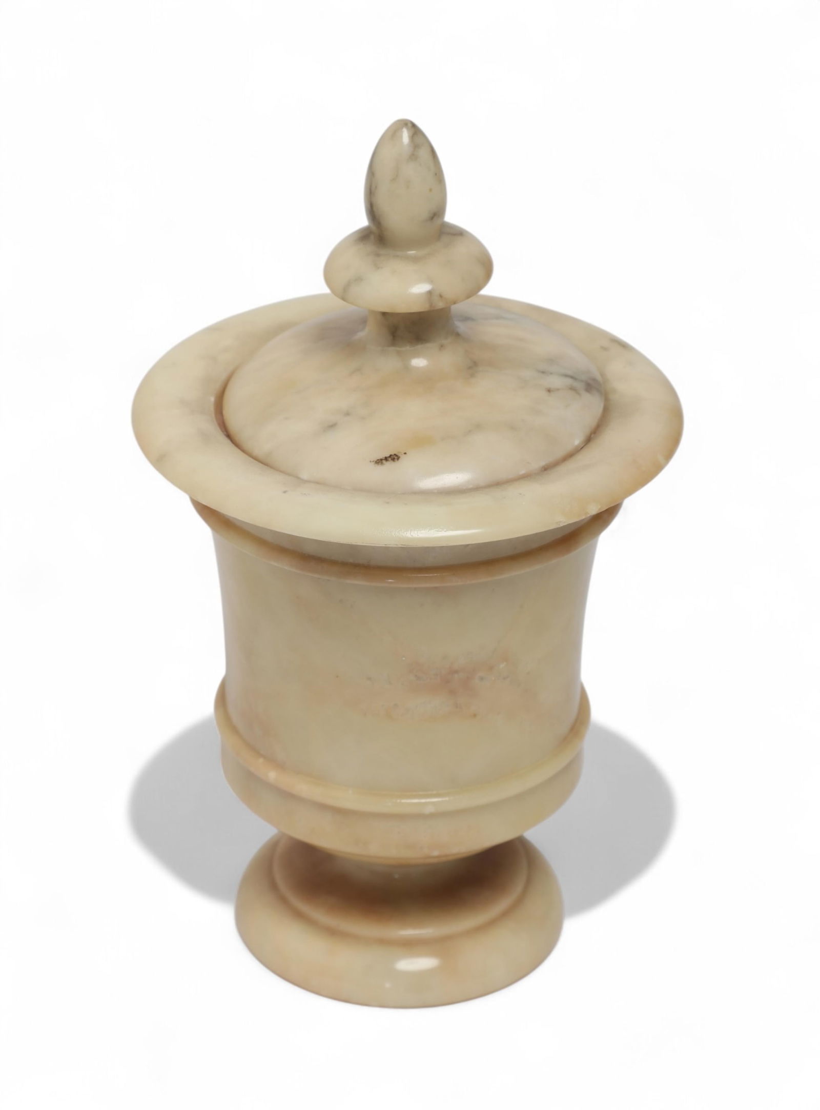 A small covered marble urn: A small covered marble urn