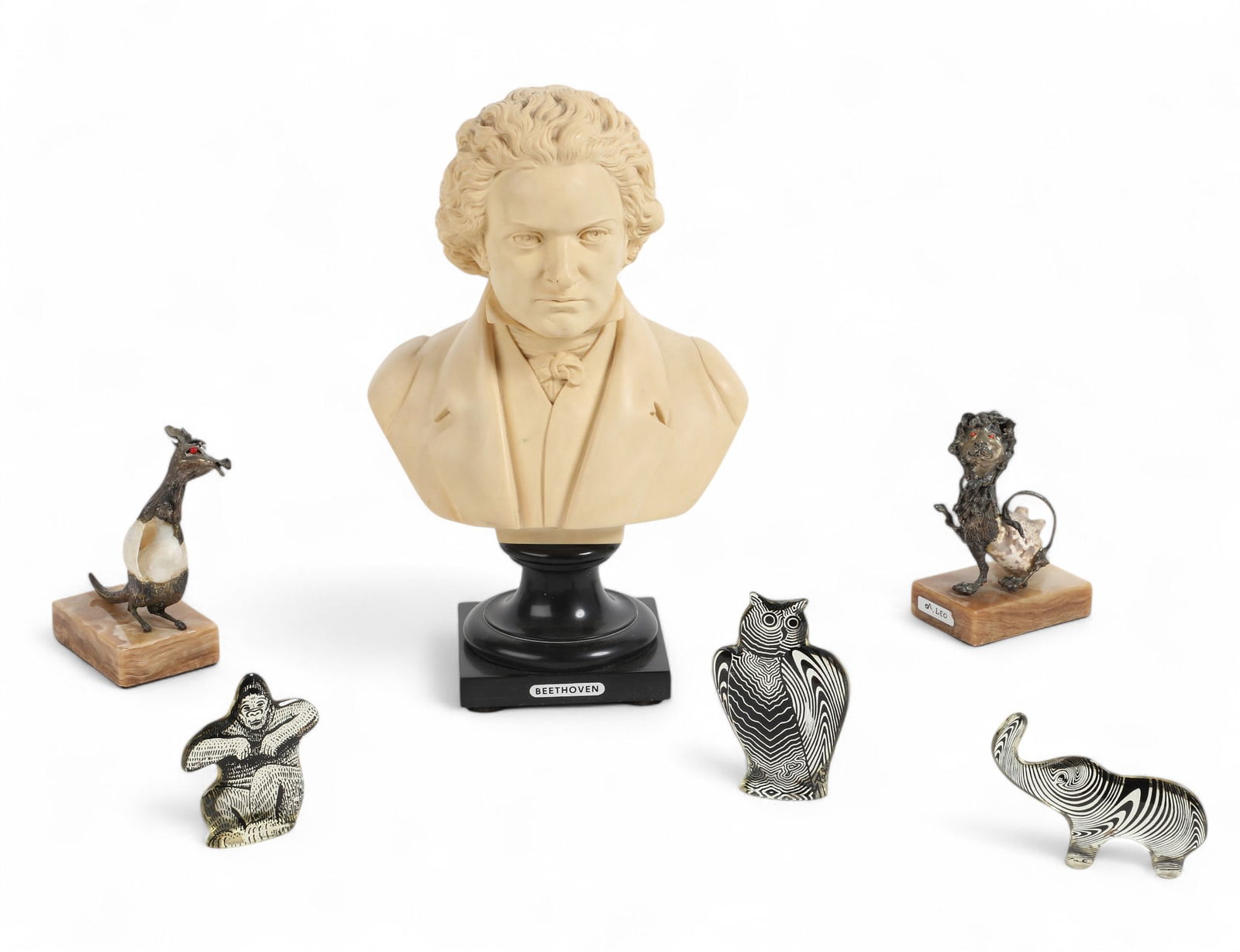 An assembled six piece group of decorative objects, modern: An assembled six piece group of decorative objects modern Comprising three acrylic models of animals, two white metal, shell and onyx models of animals and a resin bust of Beethoven. bust height 13 1/
