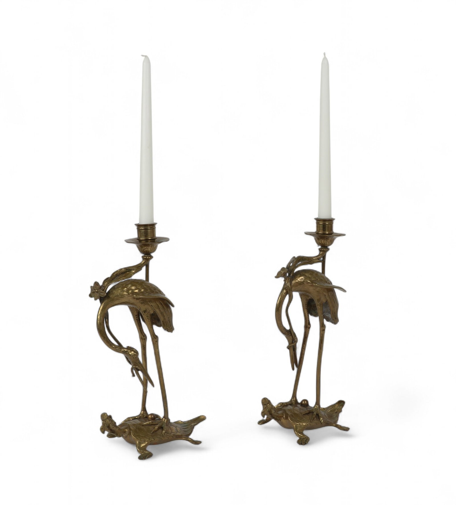 A pair of brass crane candle sticks (1 of 3)
