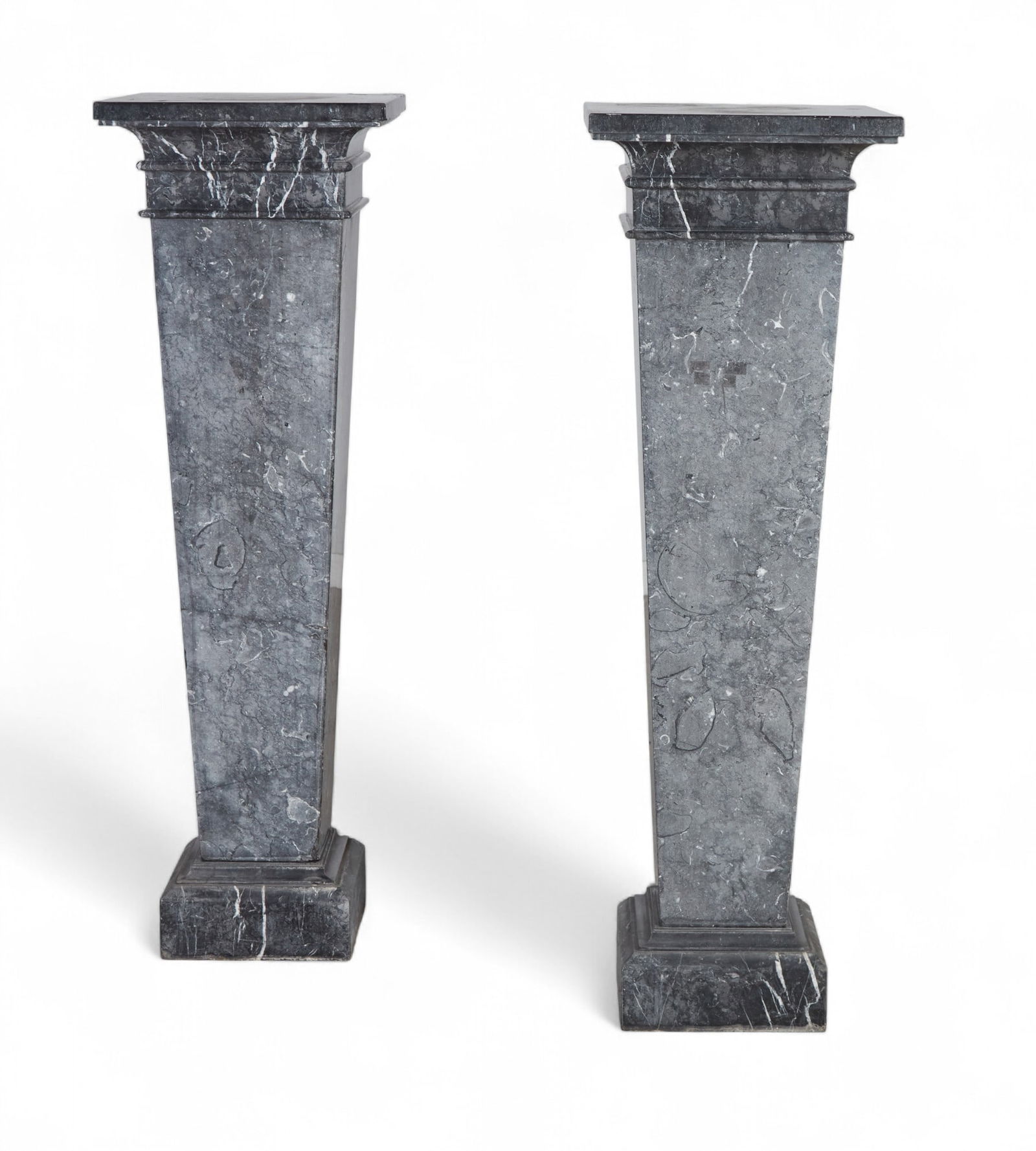 A pair of grey marble pedestals: A pair of grey marble pedestalsheight 56 x width 17 1/2 x depth 17 1/2 in. (142.2 x 44.5 x 44.5 cm.)