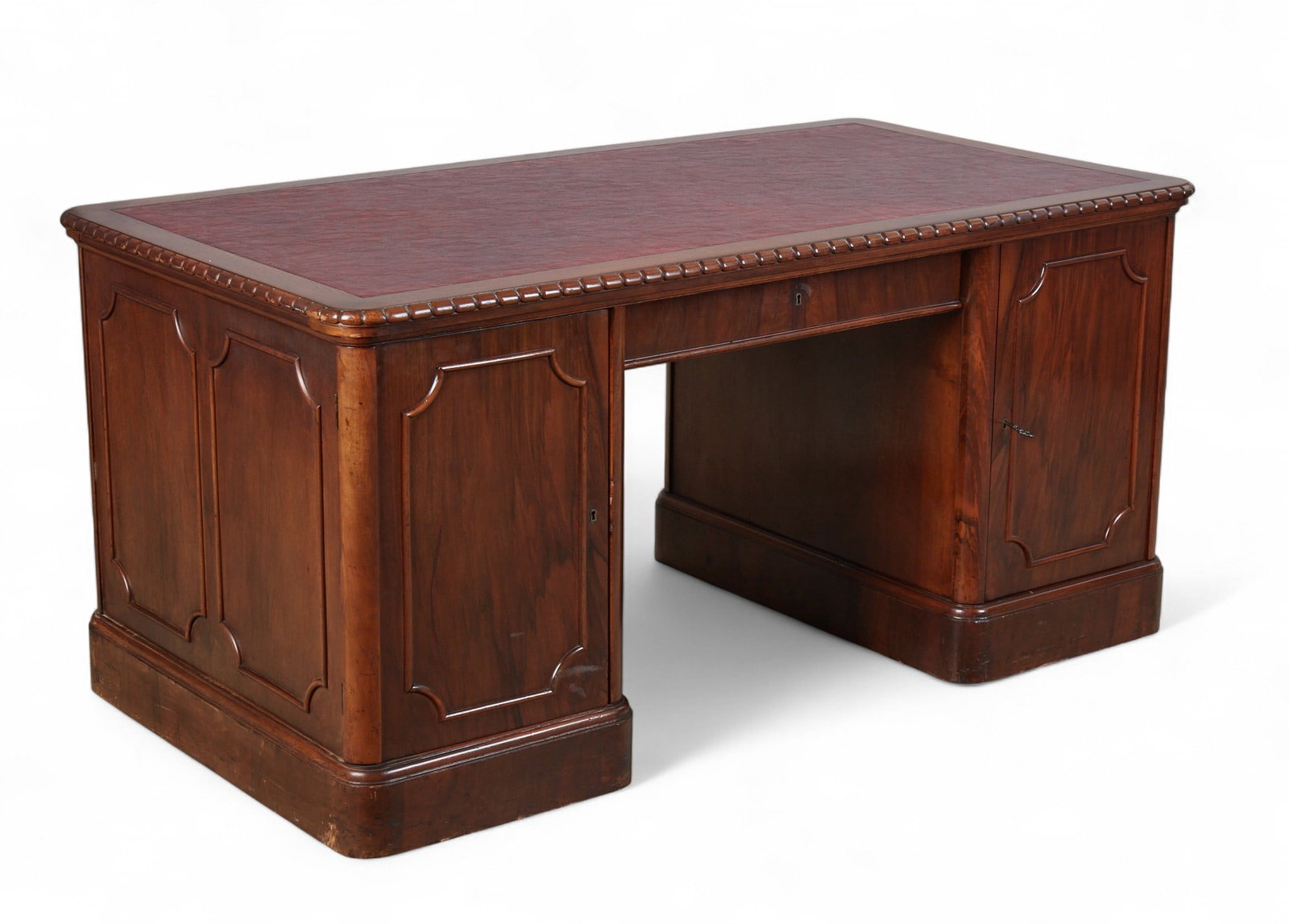 A mahogany kneehole desk, 20th century: A mahogany kneehole desk 20th century height 30in; width 63in; depth 34in