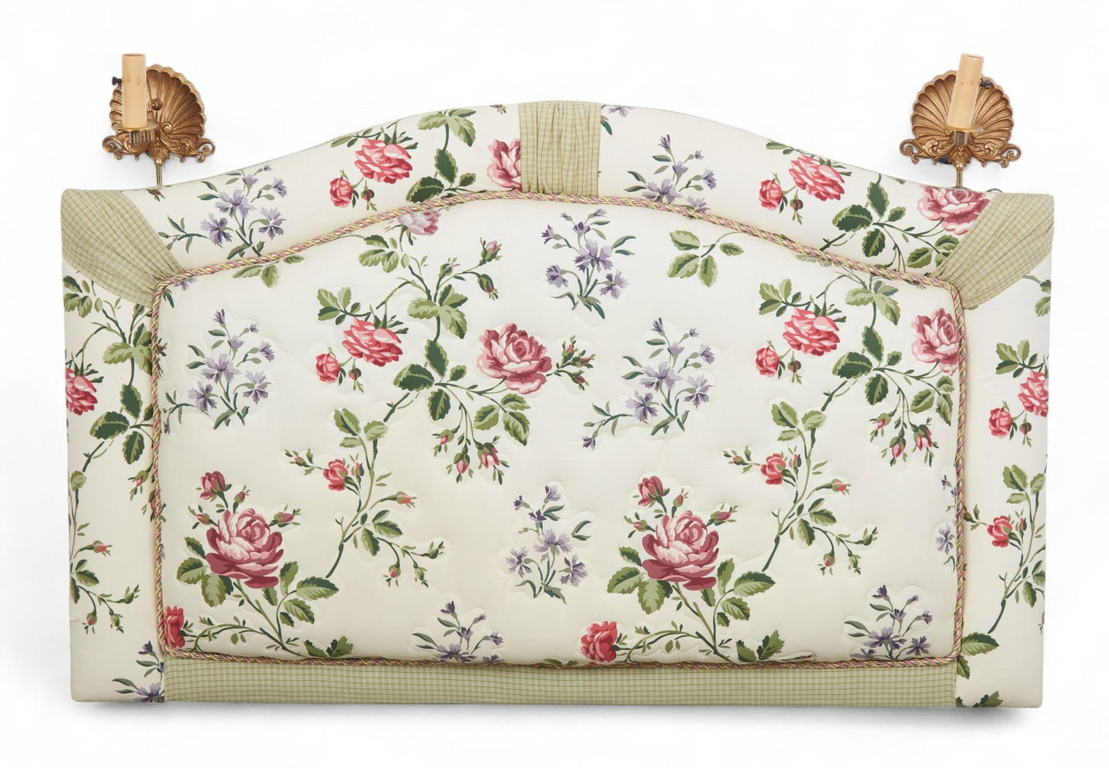 An upholstered headboard with attached wall sconces: An upholstered headboard with attached wall sconcesheight 39 x width 56 in. (99.1 x 142.2 cm.)