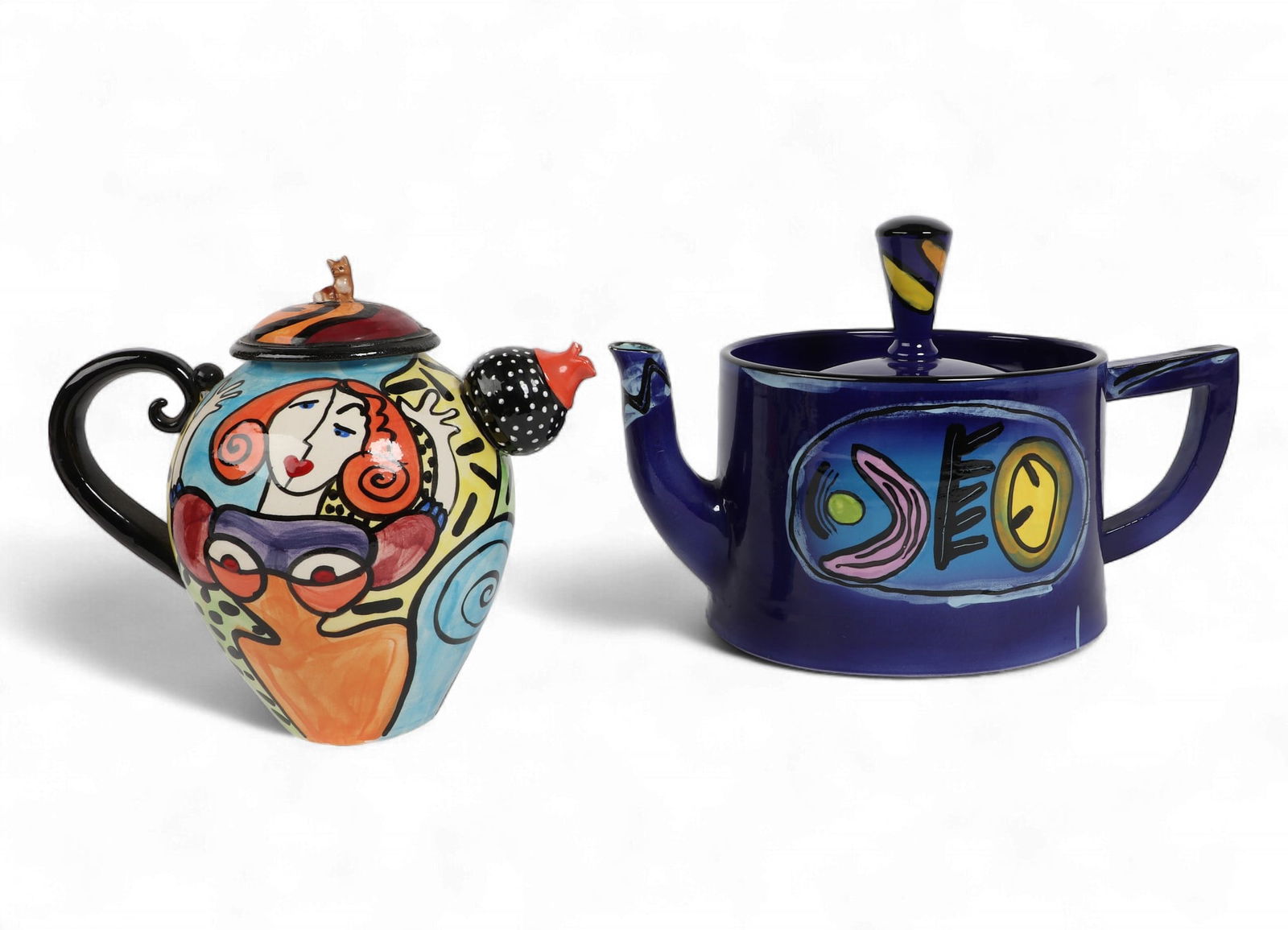 Two studio ceramic teapots, modern: Two studio ceramic teapotsmodernComprising an Anna Silver cobalt ground glazed ceramic teapot and a Lygia Dubin polychrome glazed ceramic teapot, each with painted signature to underside.largest heigh