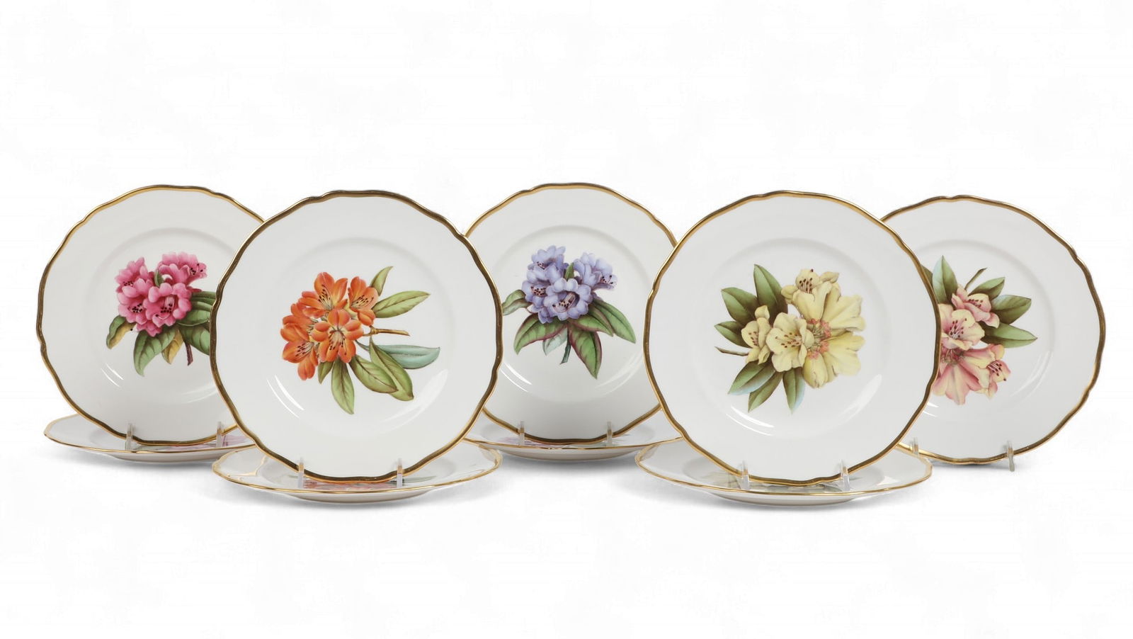 A set of nine Spode porcelain botanical side plates, circa 1964-1965: A set of nine Spode porcelain botanical side platescirca 1964-1965Each with green printed mark Spode / BONE CHINA / ENGLAND, red painted pattern number Y6638, and impressed date marks to underside.dia