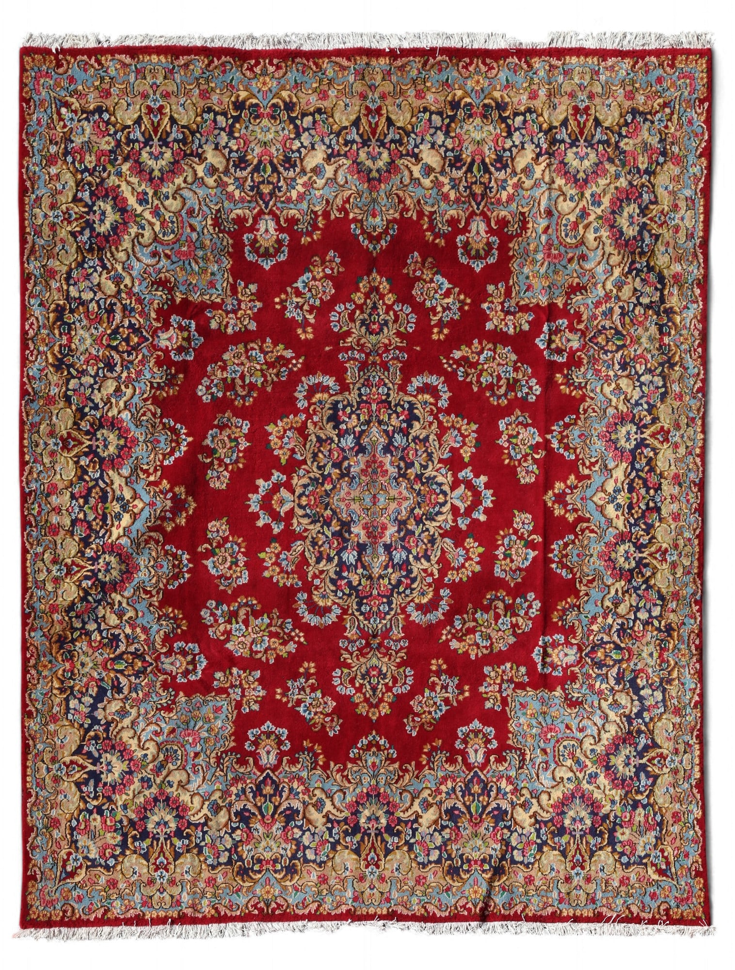 A Kerman rug: A Kerman rug approximately 13ft 4in x 10ft (390 x 250cm)