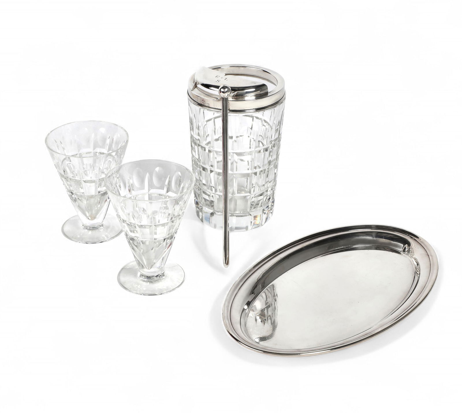 A Cartier silver and cut clear glass martini set, mid 20th century: A Cartier silver and cut clear glass martini setmid 20th centuryComprising a sterling silver mounted mixer, monogram: E*L/S, a silver clad mixing stick and a pair of glasses, cased; together with a Ca