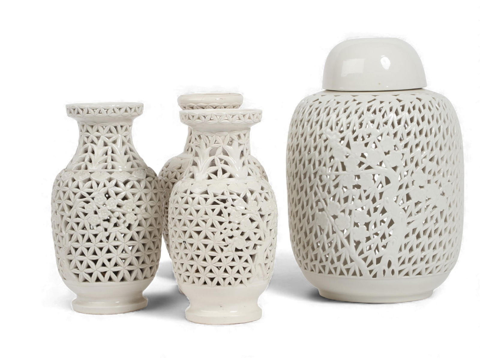 A group of four Chinese lattice work vases and urn: A group of four Chinese lattice work vases and urn Urn: height 14 x diameter 8 1/2 in. (35.6 x 21.6 cm.)