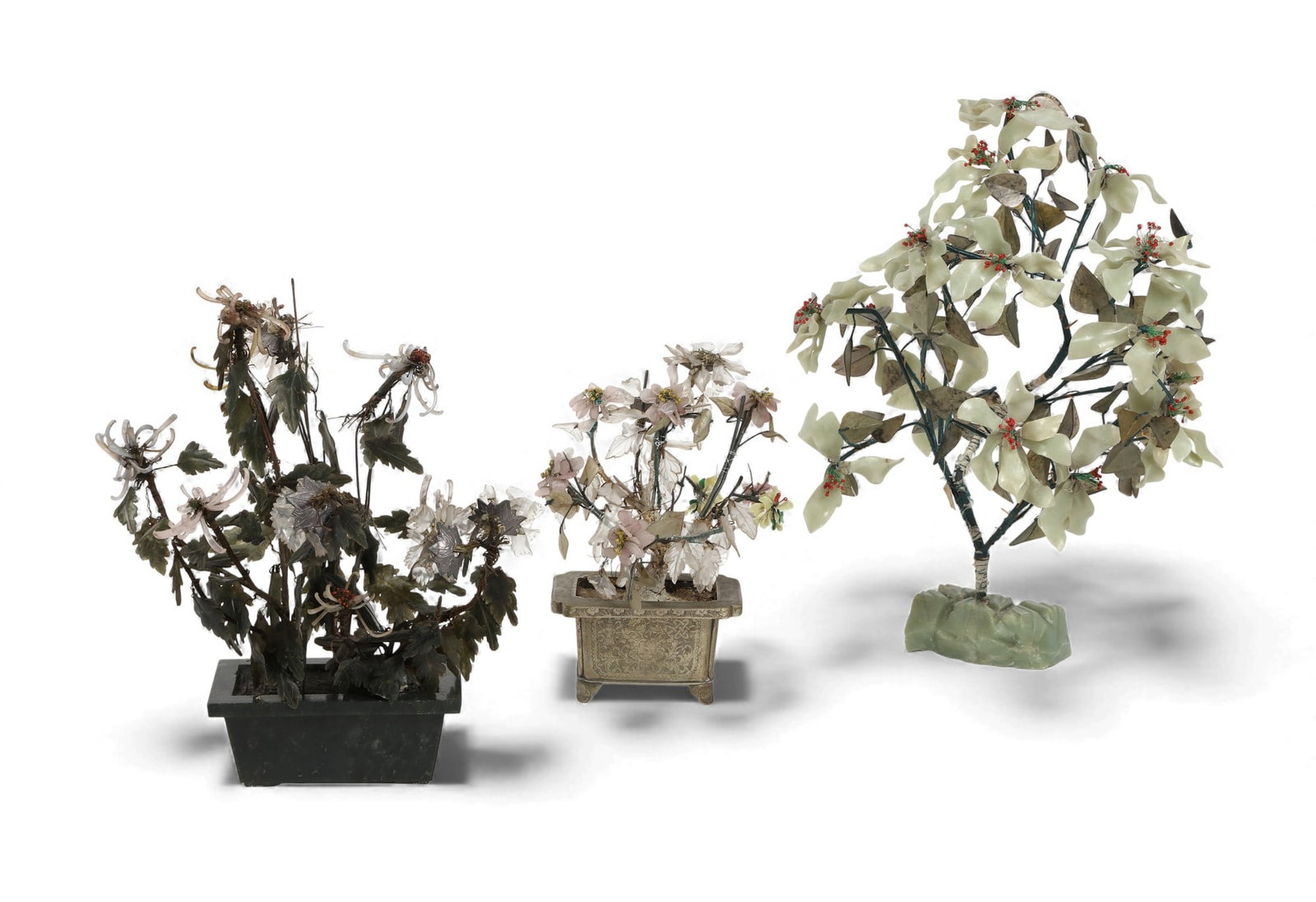 A group of three jade trees together with a carved white jade framed screen: A group of three jade trees together with a carved white jade framed screen Largest tree: height 20 x diameter 15 in. (50.8 x 38.1 cm.)