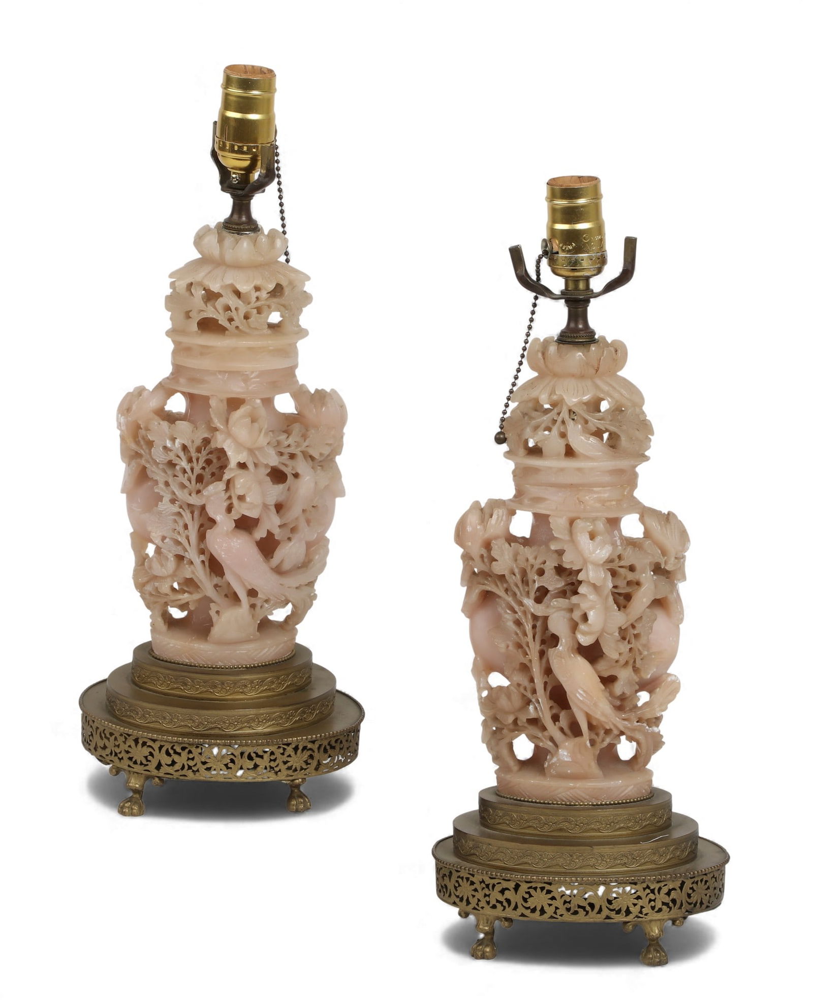 A pair of Chinese carved stone covered urns converted into lamps: A pair of Chinese carved stone covered urns converted into lamps Top of urn: height 14 x width 6 in. (35.6 x 15.2 cm.)