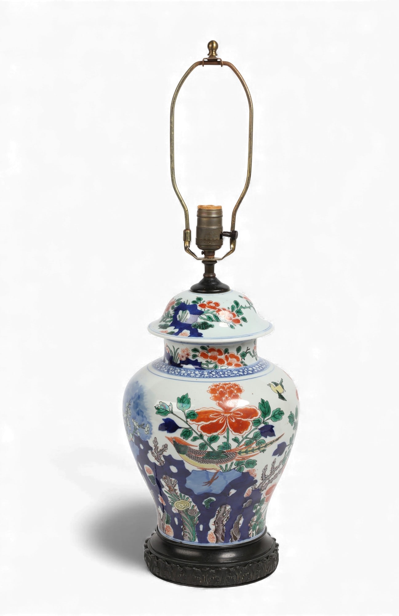 A Chinese Export glazed and enameled porcelain covered jar now as a lamp: A Chinese Export glazed and enameled porcelain covered jar now as a lampheight excluding fitments 12 1/4in (30.5cm); width 8 1/2in (21cm)
